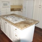 Kitchen with granite countertops and hardwood flooring