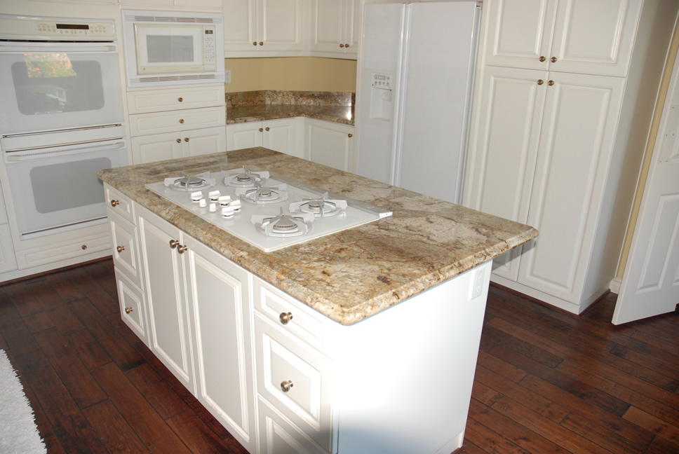 Kitchen with granite countertops and hardwood flooring