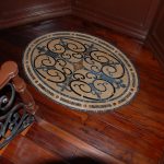 Hardwood floor with an decorative tile inlay