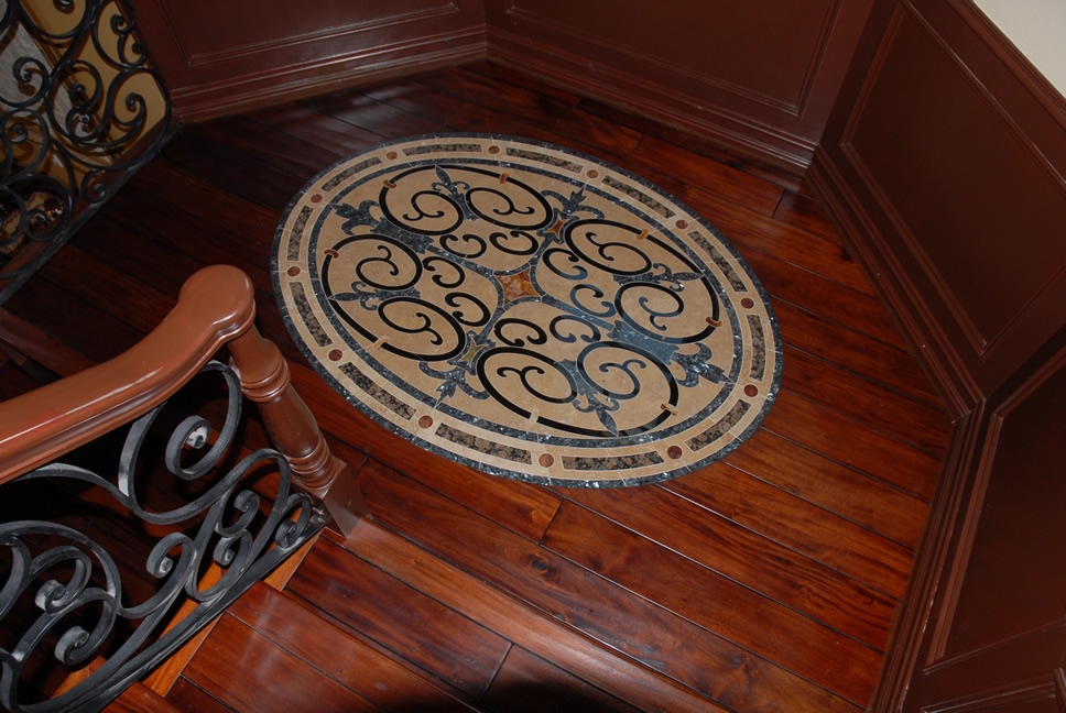 Hardwood floor with an decorative tile inlay