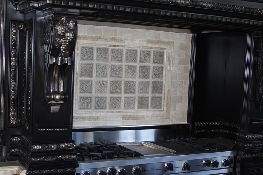 Decorative tile backsplash behind a gas stove