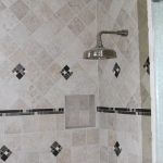 Shower with decorative tile walls