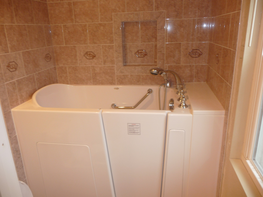 Shower with tan tile walls